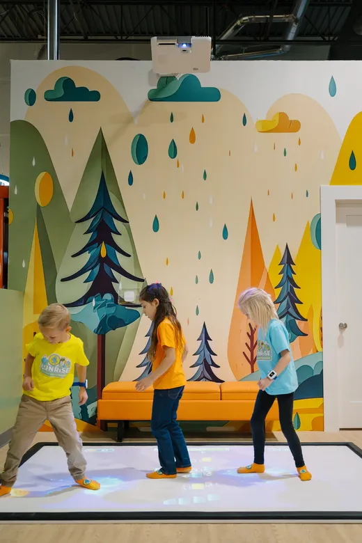 Big kids on the interactive active-play floor at Funrise