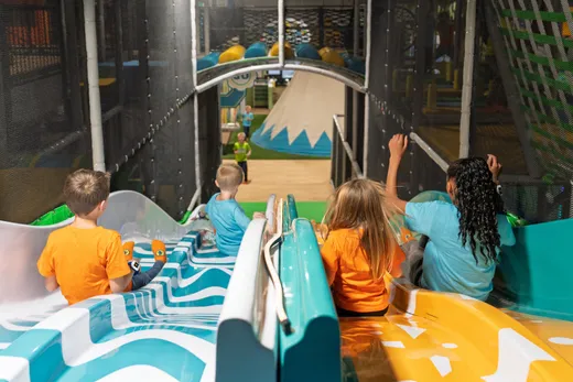 Kids on the slide at the Funrise indoor playground